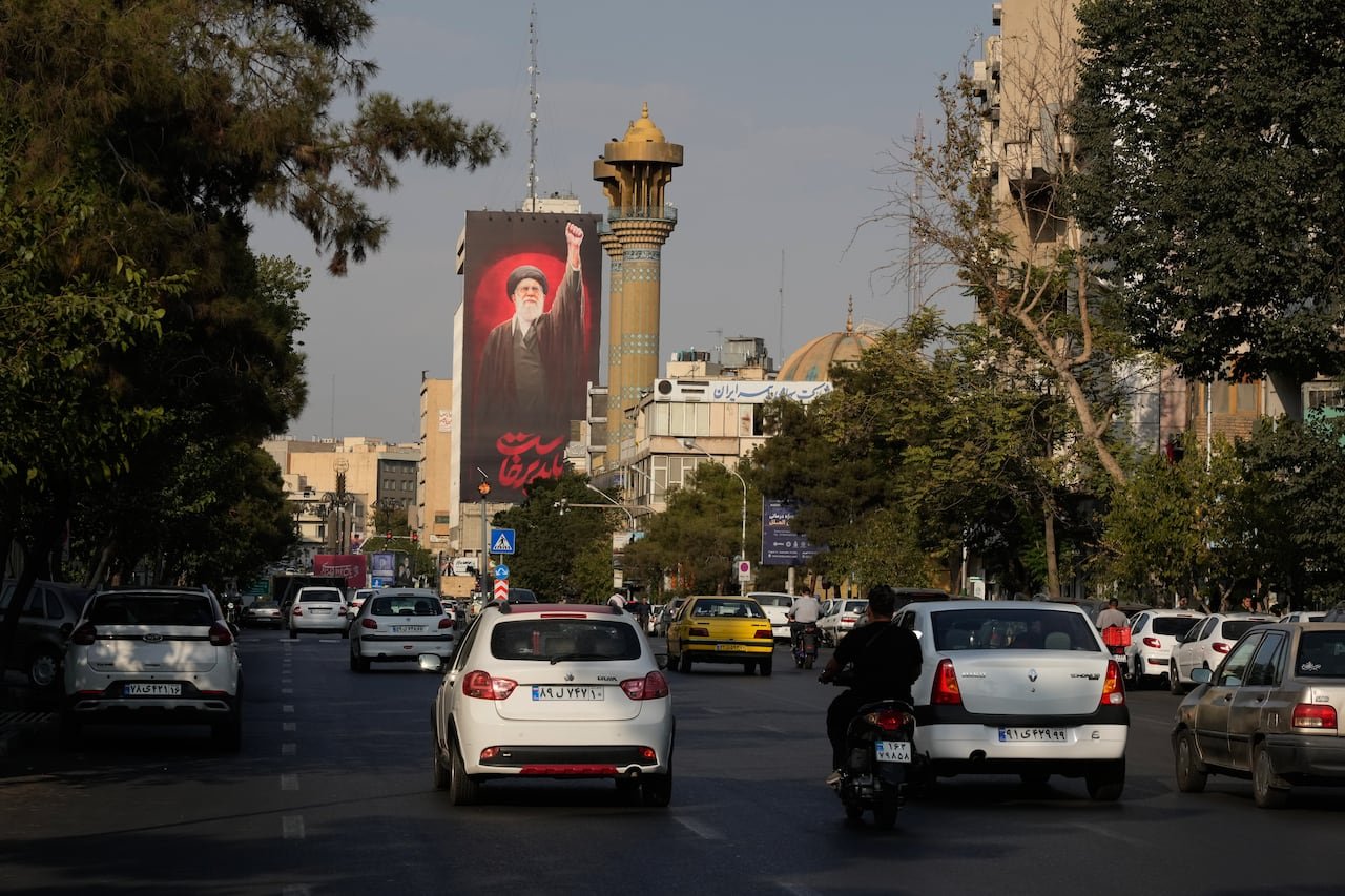 default-29 A Farsi-language billboard reading 'We must rise up' is seen in Tehran.